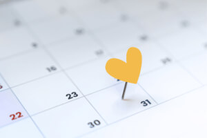 A calendar with a heart-shaped pin marking the 31st day.
